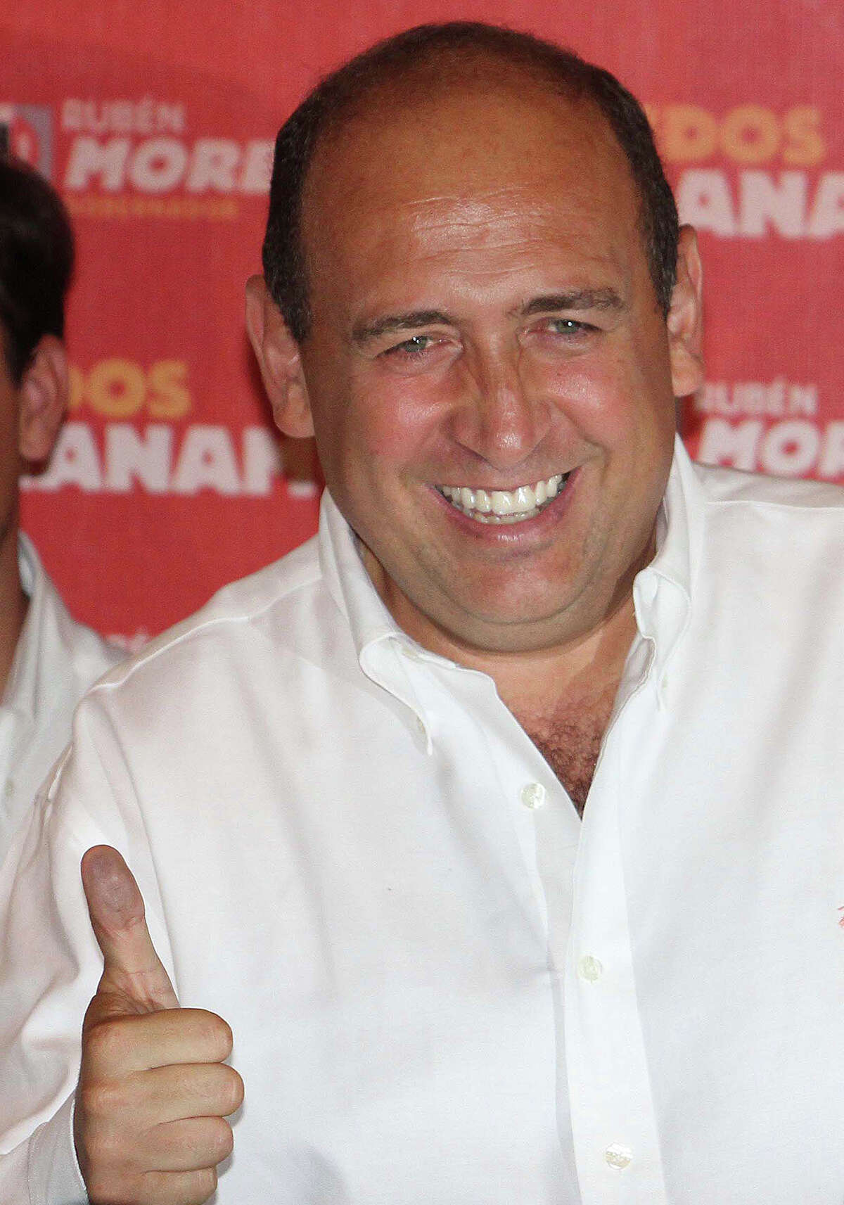 Ruben Moreira, the Institutional Revolutionary Party's (PRI) candidate for governor of the state of Coahuila, flashed a thumbs-up as he celebrated his electoral victory in Torreon, Mexico in 2011. A witness at the San Antonio federal trial of an accused leader of the Zetas drug trafficking cartel said the Zetas gave Moreira a “campaign contribution” that year — cash-packed suitcases in a Chevy Suburban. (AP Photo/Alberto Puente)