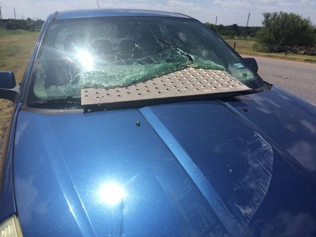 A Seguin couple walked away without injury after a sheet of metal crashed through their windshield, narrowly missing the passengers, on July 14, 2016 on Highway 123.