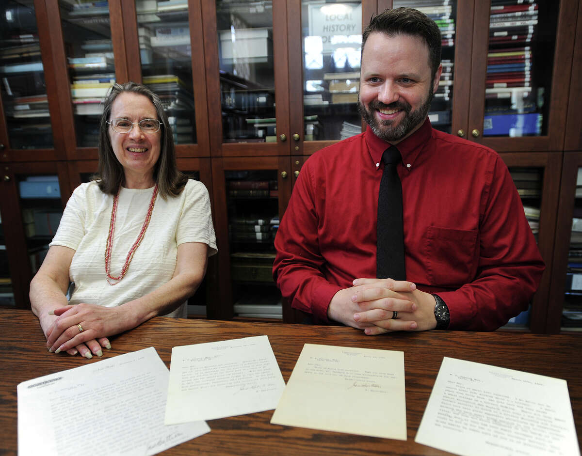 Derby Neck Library Reference Librarian Patricia Sweeney, left, and Head Librarian Ian Parsells show the four letters on Andrew Carnegie's letterhead concerning the matter of the industrialist's donation to help construct the library in 1907. Carnegie, who paid to construct libraries all over the country, donated $3,400 towards the Derby Neck construction.