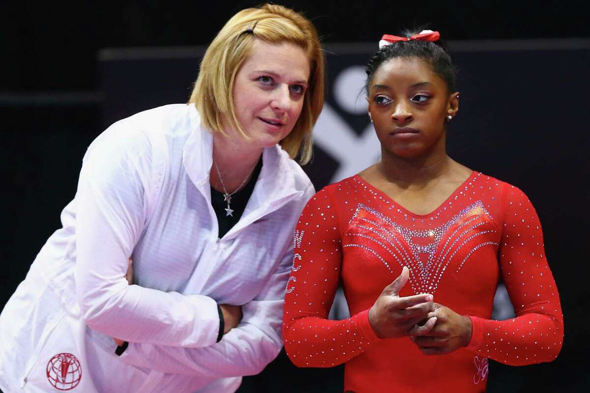 Simone Biles, right, and Aimee Boorman don't practice the usual coach-athlete relationship. Both have grown together since meeting and now head to Rio next month.