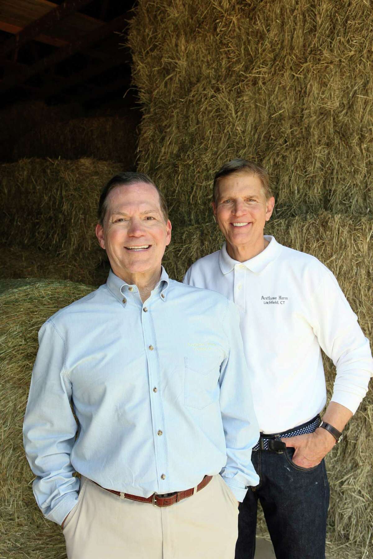 Owners of the Arethusa Farm George Malkemus, left, and Tony Yurgaitis in the hay barn on their dairy farm in Litchfield.