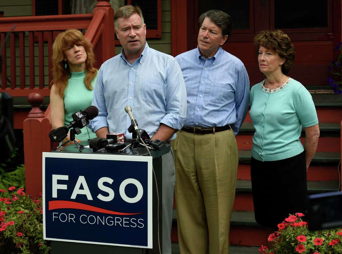 U.S. Rep. Chris Gibson, 19th CD, center, endorses John Faso, second from right, for his seat in Congress on Monday, July 18 2016, outside Gibson's home in Kinderhook, N.Y. Joining the Congressman and candidate are Mary Jo Gibson, left, and Mary Francis Faso, right. (Skip Dickstein/Times Union)