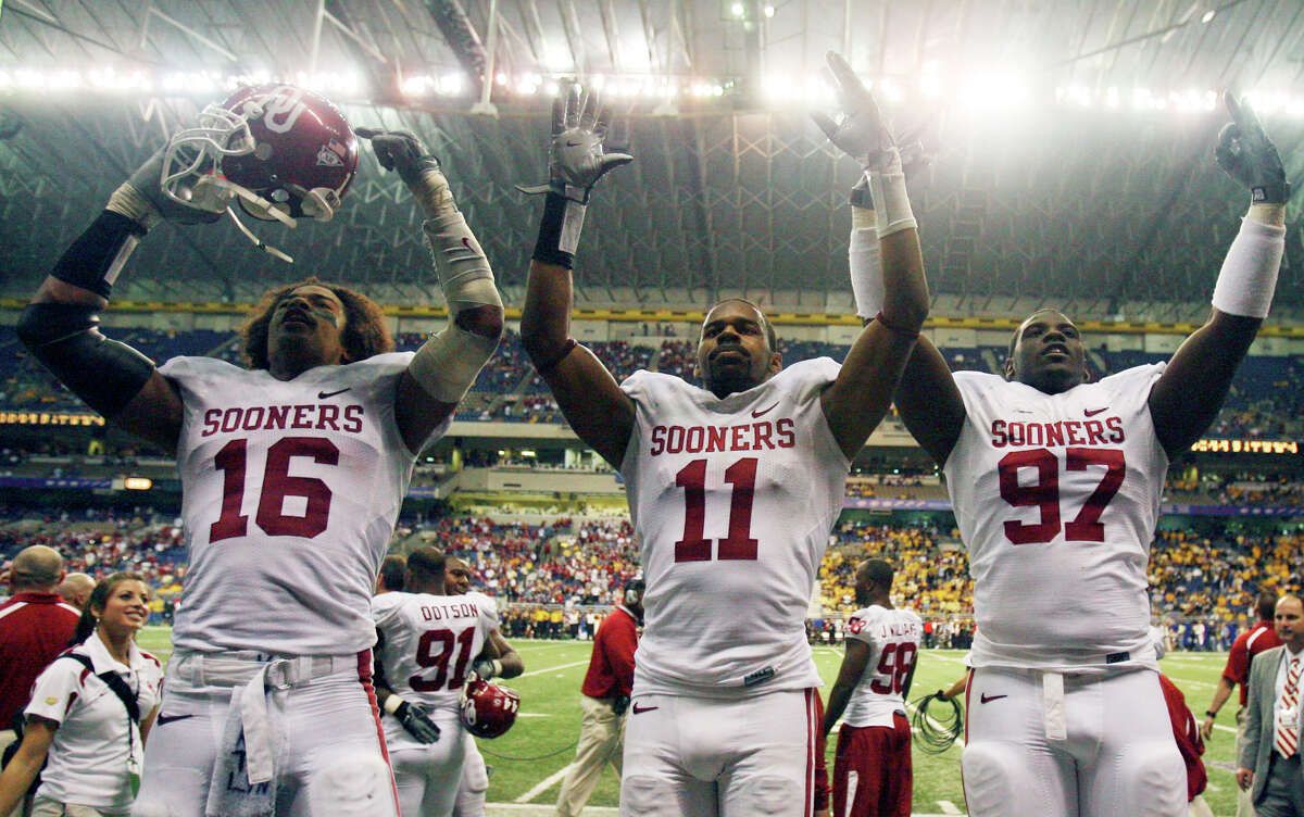 Oklahoma Sooners Lewis Baker (from left) Lendy Holmes and Cory Bennett celebrate their 38-17 win over the Missouri Tigers during the Big 12 championship game on Dec. 1, 2007 at the Alamodome.