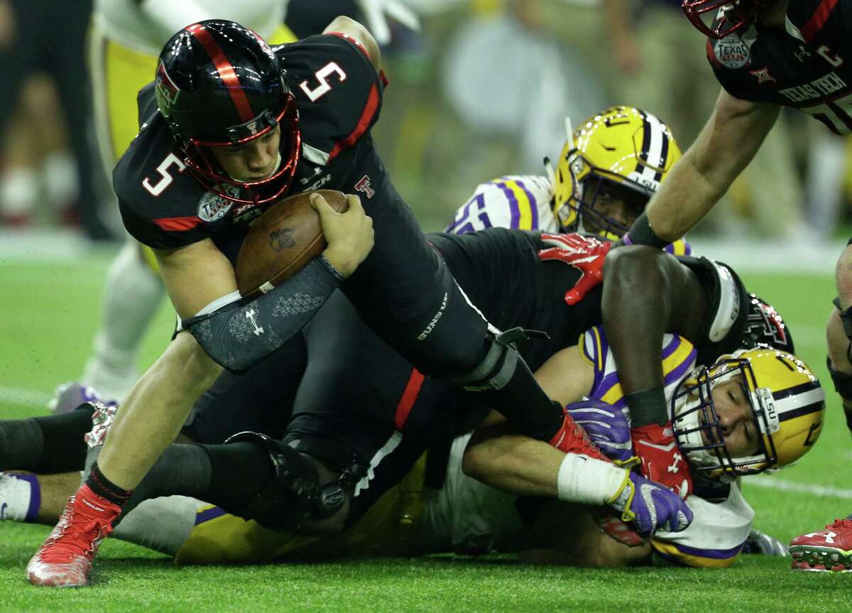 Texas Tech quarterback Patrick Mahomes is brought down by LSU defensive end Tashawn Bower (46) for a sack during the third quarter of the Texas Bowl at NRG Stadium on Dec. 29, 2015, in Houston.