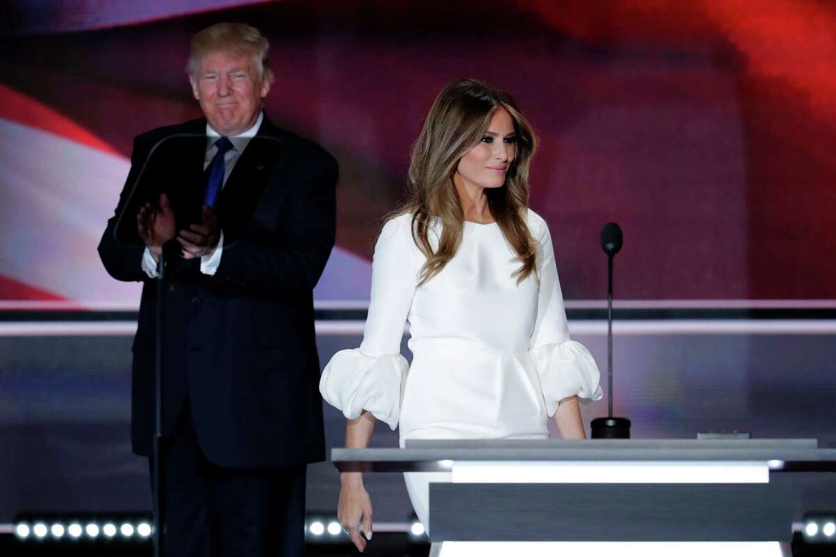 Melania Trump, wife of Republican Presidential Candidate Donald Trump walks to the stage as Donald Trump applaudss during the opening day of the Republican National Convention in Cleveland, Monday, July 18, 2016.