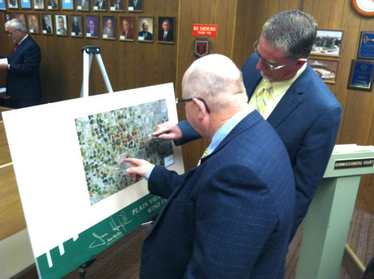 Ryan Crowe/Plainview HeraldCounty Commissioners Benny Cantwell (left) and Harold King study a map showing the proposed area of a new wind farm, to be placed just northwest of the city of Plainview.