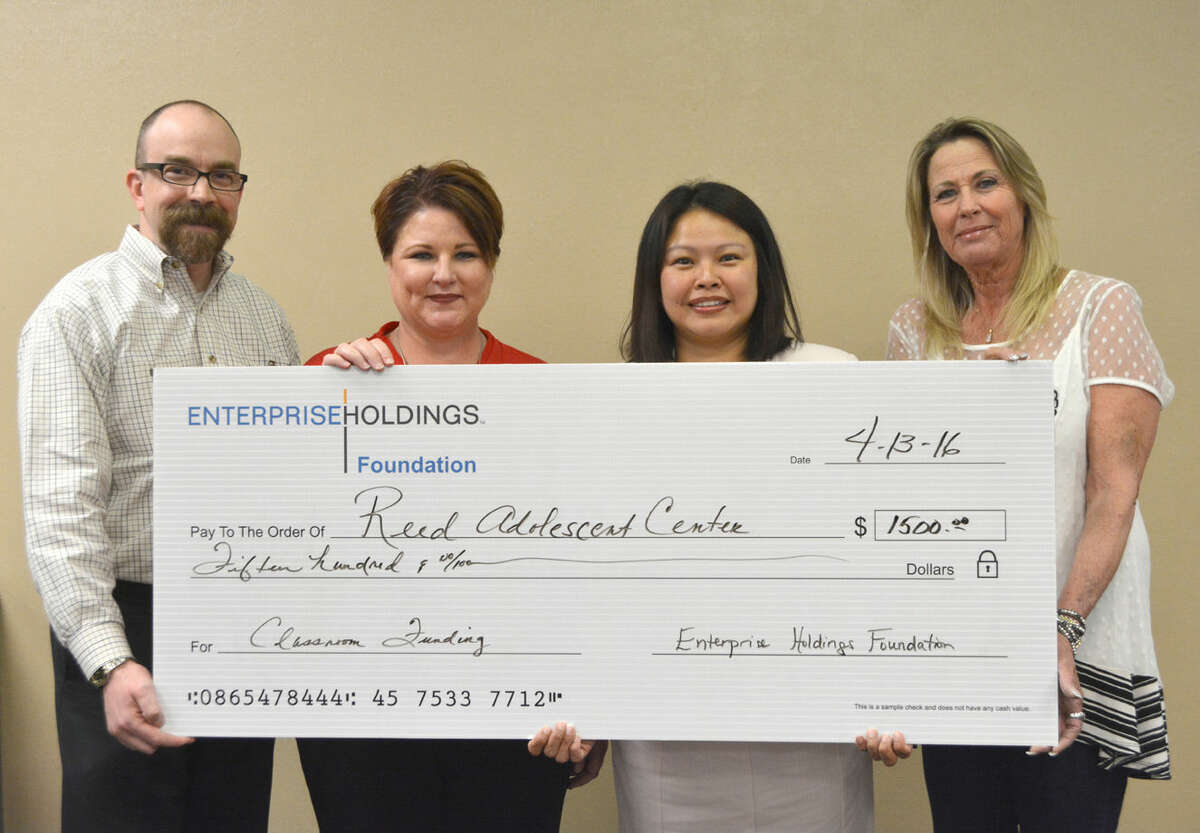 The Enterprise Holdings Foundation has donated $1,500 to Reed Adolescent Center for the purchase of computers and educational materials. The foundation is the philanthropic arm of Enterprising Holdings, which, through its regional subsidiaries, operates the Enterprise Rent-A-Car, National Car Rental and Alamo Rent A Car brands. Part of Central Plains Center, Reed Adolescent Center is an intensive residential facility for alcohol and drug rehabilitation for individuals who are 13 through 17 years old. On hand for the grant presentation are Jason Johnson (left), Central Plains CFO; Sherri Bohr, Central Plains chief services officer; Hien M. Nguyen, Enterprise Fleet Management account manager; and Stacy Johnson, Central Plains Center director of substance abuse.