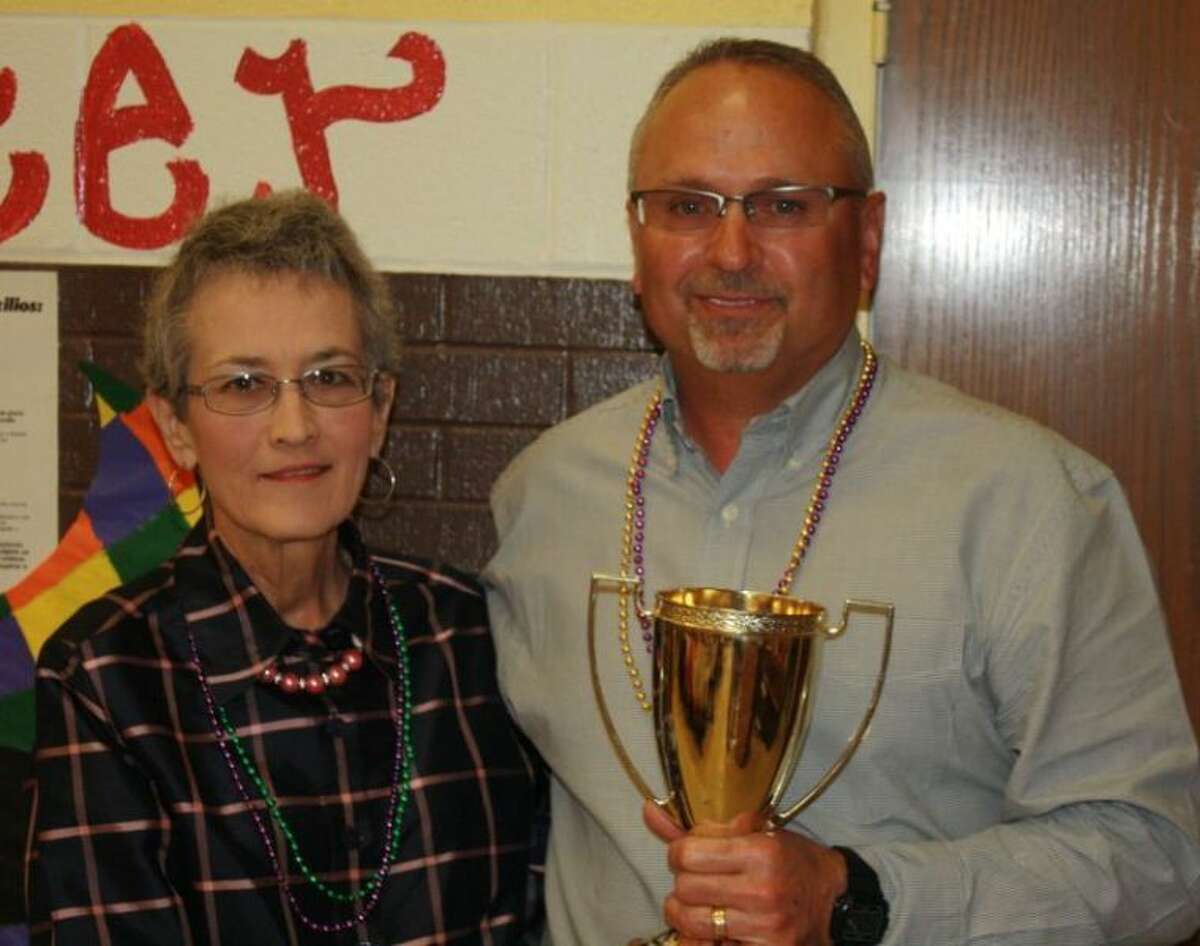 Phil Cotham was recognized as the 2013 Lockney Chamber of Commerce Citizen of the Year. Kay Martin, one of the 2012 recipients, presented Cotham with his trophy.