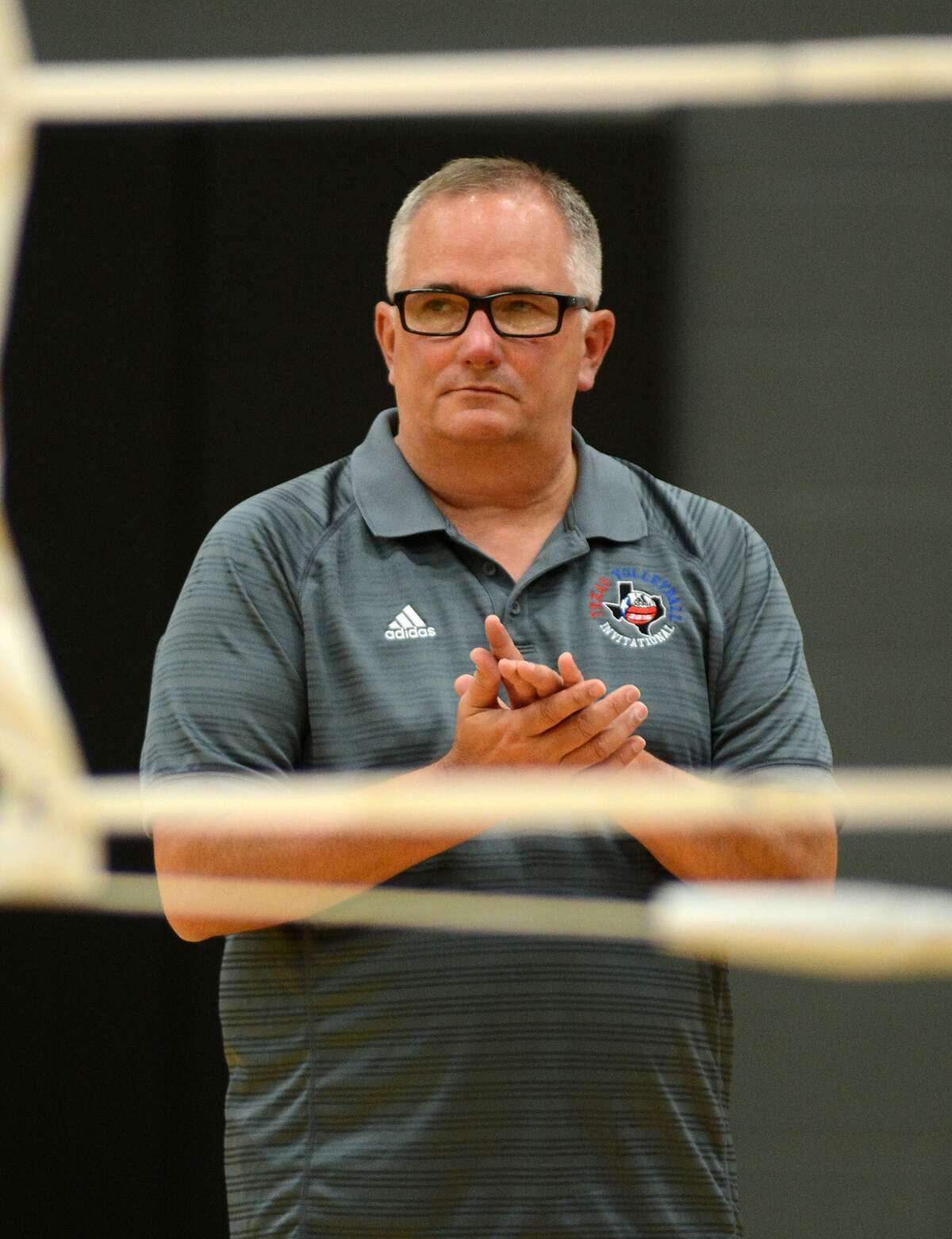 Pearland head volleyball coach John Turner watches his team during their scrimmage against Katy Taylor at Pearland High School on Aug. 8, 2015. (Photo by Jerry Baker/Freelance)