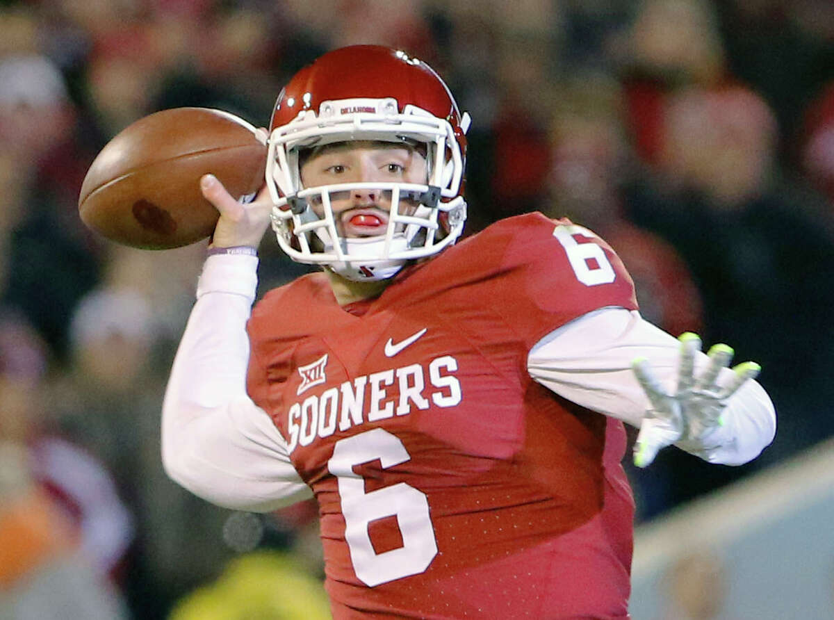 In this Nov. 21, 2015, file photo, Oklahoma quarterback Baker Mayfield (6) looks to pass against TCU during the first quarter in Norman, Okla. Oklahoma quarterback Baker Mayfield is the unanimous pick as the Big 12 offensive player of the year and one of seven Sooners on the Associated Press All-Big 12 first team.