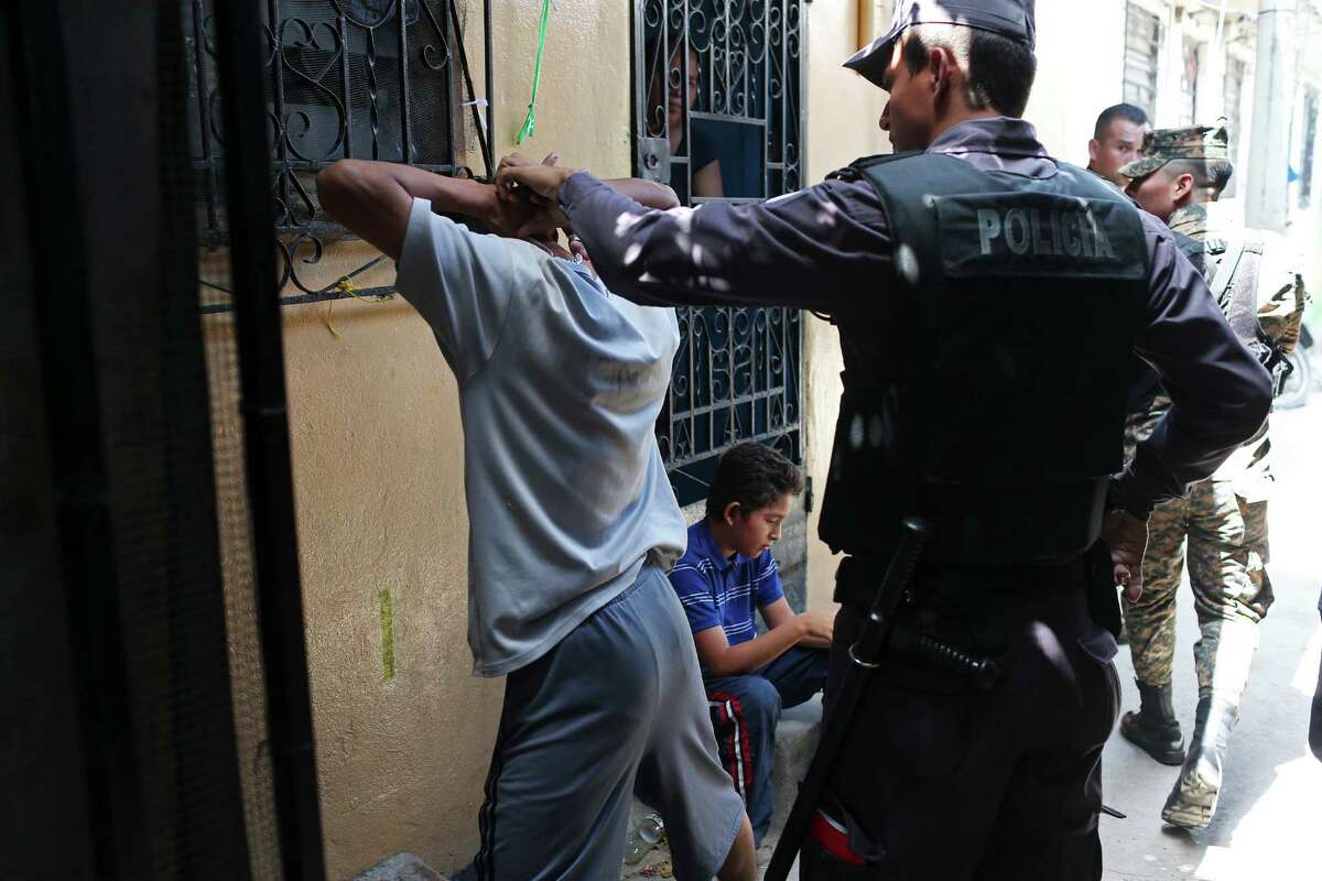 Members of the Salvadoran military and the Policia Nacional Civil question a young man as they patrol the alleys of the Colonia Jardin de Don Bosco in San Salvador, El Salvador, Wednesday, April 6, 2016. The neighborhood, like others in El Salvador, is home to two of the most powerful gangs in the country, MS-13 and Barrio 18. During their security detail, the soldiers will question young men and women in order to ascertain if they have a gang affiliation. There were no arrests during the operation.