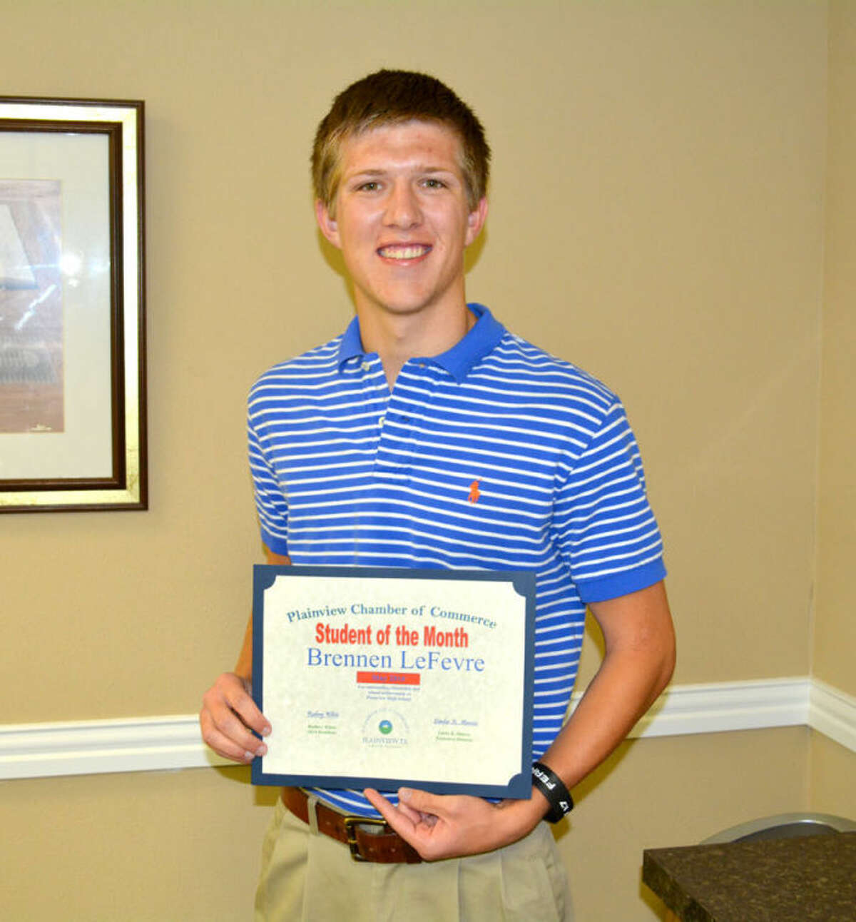 Doug McDonough/Plainview HeraldBrennen LeFevre, a senior at Plainview High School, was introduced Tuesday as the Chamber of Commerce Student of the Month. The 18-year-old son of Chris and Michele LeFevre, he has been active in PHS athletics for the past four years, including three years in varsity football and one year as team captain. He has been in National Honor Society for three years (two years as officer), FFA four years (three years as officer), National Technical Honor Society for two years, Student Council one year and choir for two years. His awards include All-District Honorable Mention in football (2012), All-District Second Team Cornerback (2013), All-State Academic Football First Team (2013), All-South Plains Second Team Cornerback (2013), football team captain (2013), state qualifier in Land Judging (2010-11), Top 10 Individual Area Land Judging (2010-14), Area Qualifier for Chapter Conducting (2010-14), Merit P Award (2010-14), invitation to join National Society of High School Scholars (2013), WTAMU Academic Scholarship ($12,000 over a four-year period), PHS Class of 1956 Scholarship, ranked fifth in the PHS Class of 2014. LeFevre has been an FFA officer since 2012 and NHS officer since 2012. He has been involved on the Centennial Bank Junior Board of Directors, Salvation Army bell ringer, Read First, First United Methodist Church Youth Group and participated in a mission trip to Moore, Okla., in March 2014. His hobbies include spending time with family and friends, and being active in his church and its youth group. He plans to attend West Texas A&M University and pursue a degree in mechanical engineering.