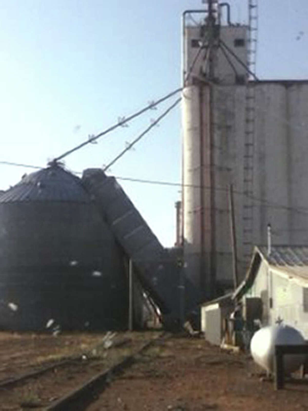 A storm that pushed through Hart shortly before 7 p.m. Wednesday pushed a grain drier against a metal silo at the Northern Ag elevator in Hart in this scene captured by Herald carrier Salvador Arteaga. Several residents in the area report that damage was caused by a tornado, although it has not been confirmed by the National Weather Service.