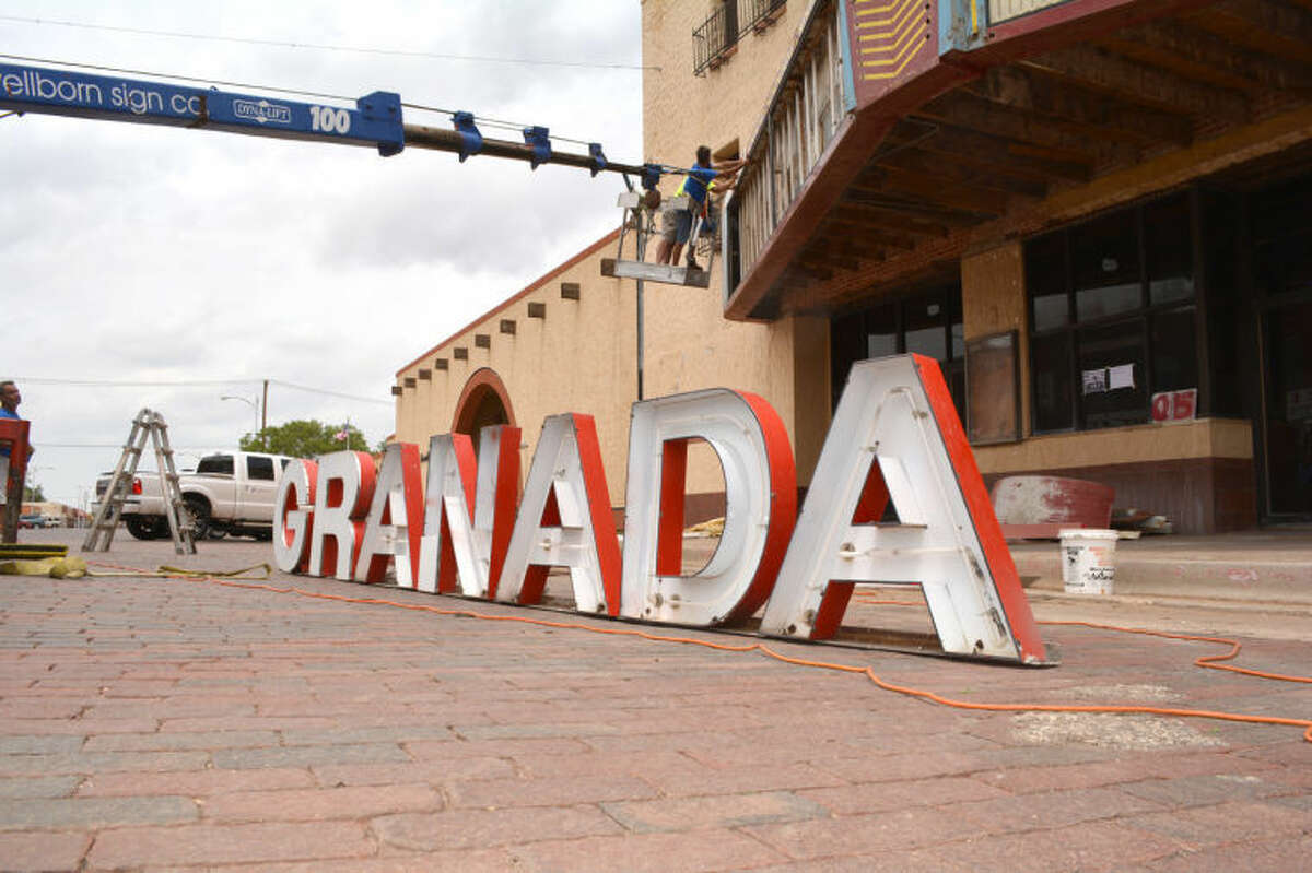 Doug McDonough/Plainview HeraldAfter decades atop the marquee at the Granada, the letters which spelled out the theater’s name were in the street Thursday, ready to be loaded onto a truck and taken to Amarillo. Once there, crafters with Wellborn Sign Co. will restore the neon tubing so that they can once again light up the entrance to the historic theater. The latest phase of the theater restoration began Thursday with the partial disassembly of the theater’s marquee.