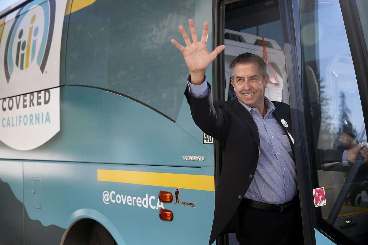 Peter Lee, executive director of Covered California, boards a tour bus after a stop at Kaiser Permanente Medical Center in Oakland, Calif. on Friday, Nov. 6, 2015. A Covered California entourage is on a 38-stop bus tour up and down the state to spread the word about the open enrollment period.
