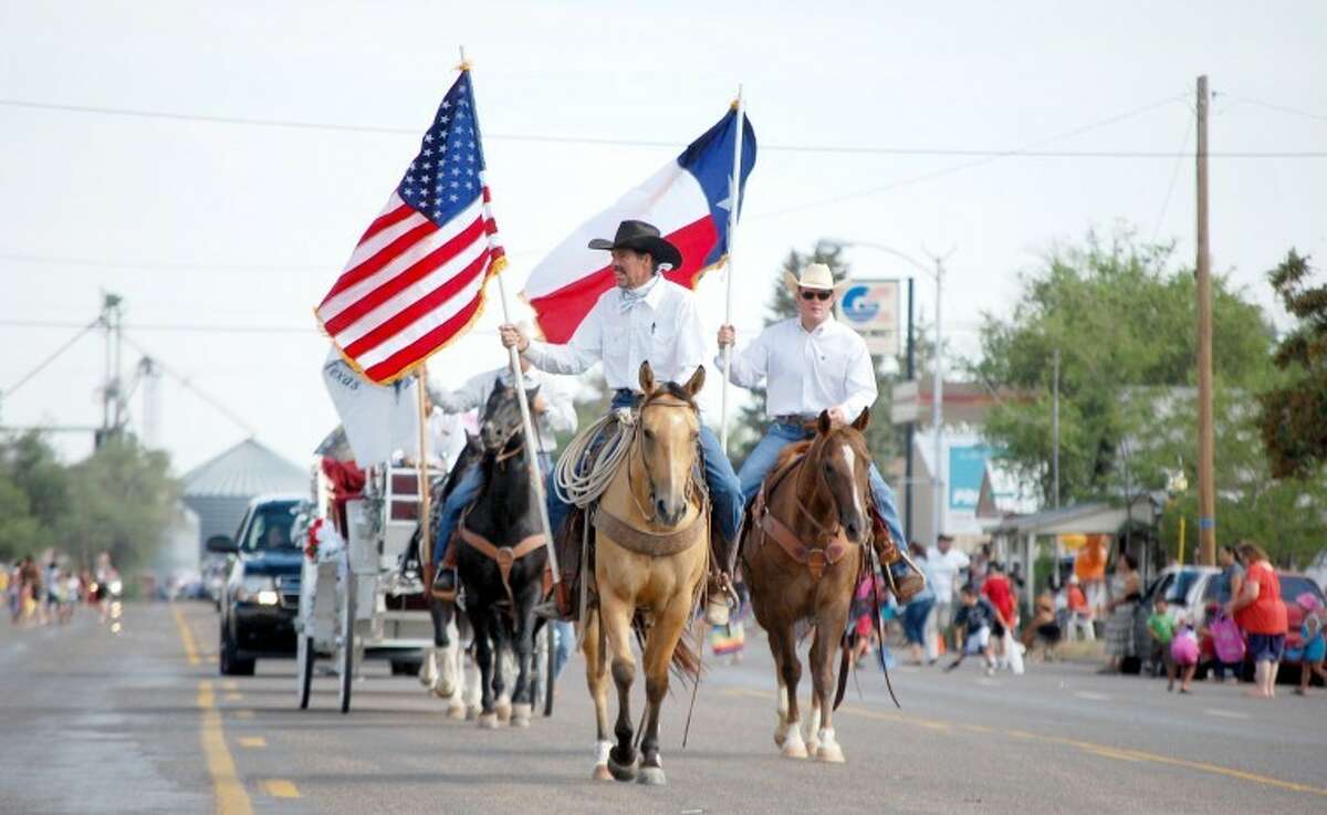 Saturday's parade marking the 32nd annual Sandhills Celebration at Olton began in the traditional way with a mounted color guard.