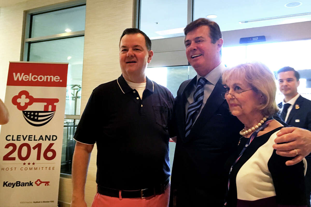 Trump campaign manager Paul Manafort, center, poses for a photograph with state Rep John Frey of Ridgefield and Pat Longo of Norwalk during a Connecticut GOP breakfast Tuesday, July 19, 2016, in Cleveland. Frey and Longo both serve on the Republican National Committee.