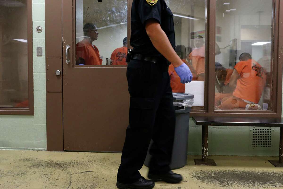Inmates wait in a holding unit in the intake area of the Bexar County Jail, Monday, July 18, 2016. The inmate's evaluated for mental and physical health problems before being released into the jail population. Between the beginning of the year and July 14 there have been 924 suicide attempts at the jail. Three inmates have died as a result, all in the last three weeks.