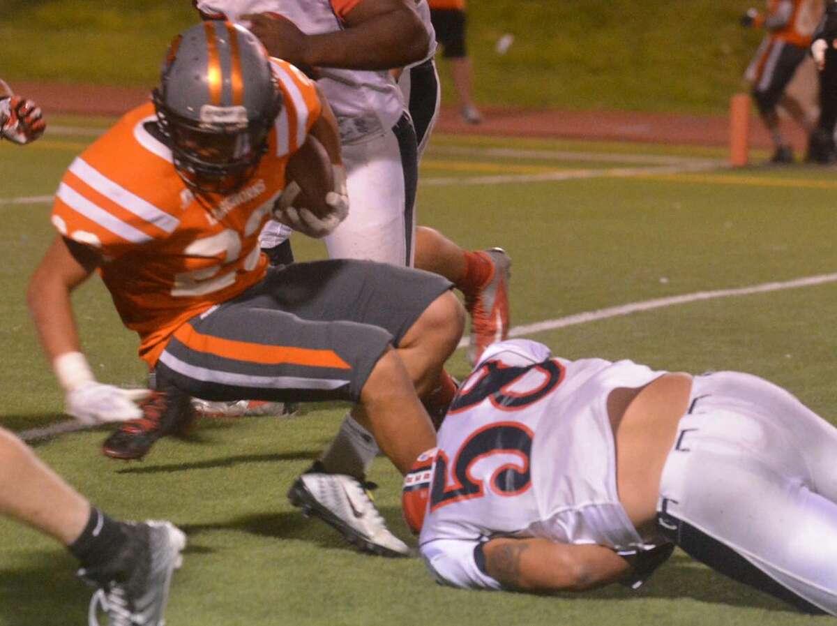 Plainview defensive lineman D'Angelo Thomas (58) tackles Caprock's Patrick Rueda at the 5-yard line on a fourth-down play to thwart a Longhorn scoring attempt. The goal-line stand came with less than a minute left in the first half of a 41-14 Plainview victory.
