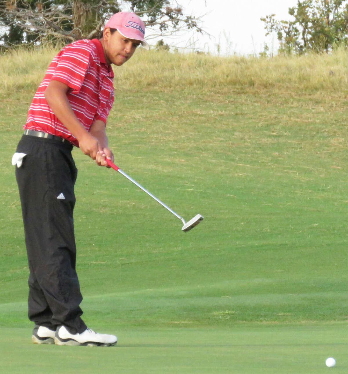 Plainview's Isaiah Garcia follows through on a shot during the Red Raider Classic in Lubbock. Garcia led the Bulldogs with a two-round total of 150 in the tournament, which was played at Shadow Hills Golf Course and The Rawls Course.