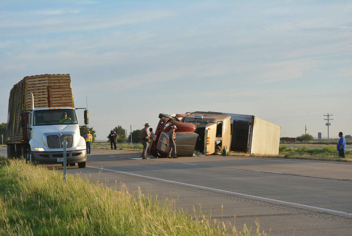 Doug McDonough/Plainview HeraldAn 18-wheel truck-trailer combination overturned shortly before 8 a.m. Friday, Sept. 5, as it was negotiating a slight curve in Interstate 27 about one mile south of the FM 788 overpass at Finney. The truck was traveling south on the highway when the mishap occurred. There were no apparent injuries, although traffic was disrupted until the truck could be pulled upright and removed.