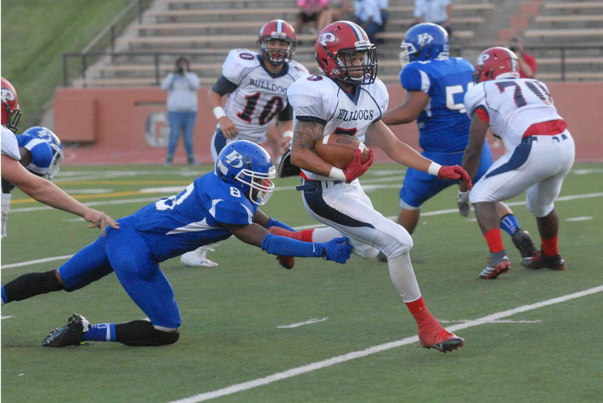 Plainview running back Warren Flye races past a Palo Duro defender during last week's football game. Flye, a senior, gained 158 yards rushing against the Dons and has 214 yards on the ground in two games. The Bulldogs make their home debut this week when the host Canon at 7:30 p.m. Friday.
