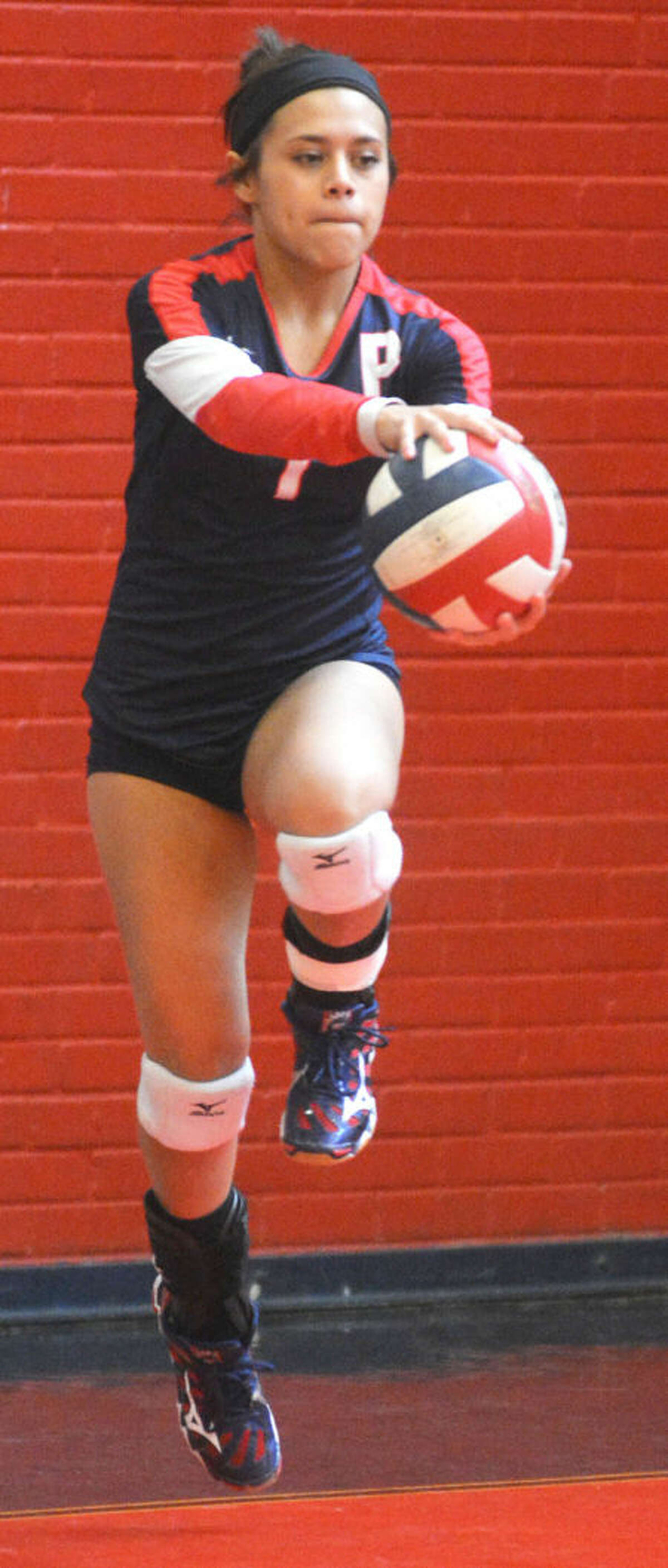 Plainview's Kim Balderas begins her approach on a serve during the Lady Bulldogs' victory over Caprock Saturday.