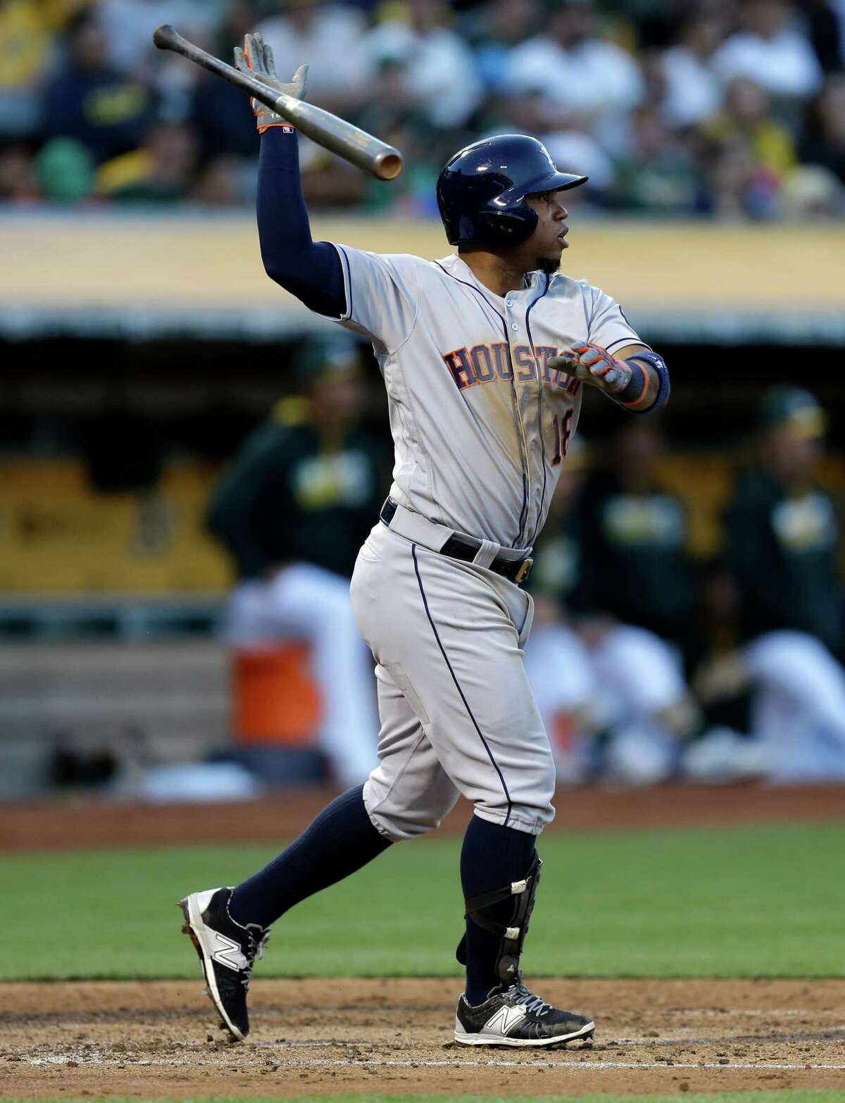 Houston Astros' Luis Valbuena tosses his bat after hitting an RBI single off Oakland Athletics' Dillon Overton in the third inning of a baseball game Tuesday, July 19, 2016, in Oakland, Calif. (AP Photo/Ben Margot)