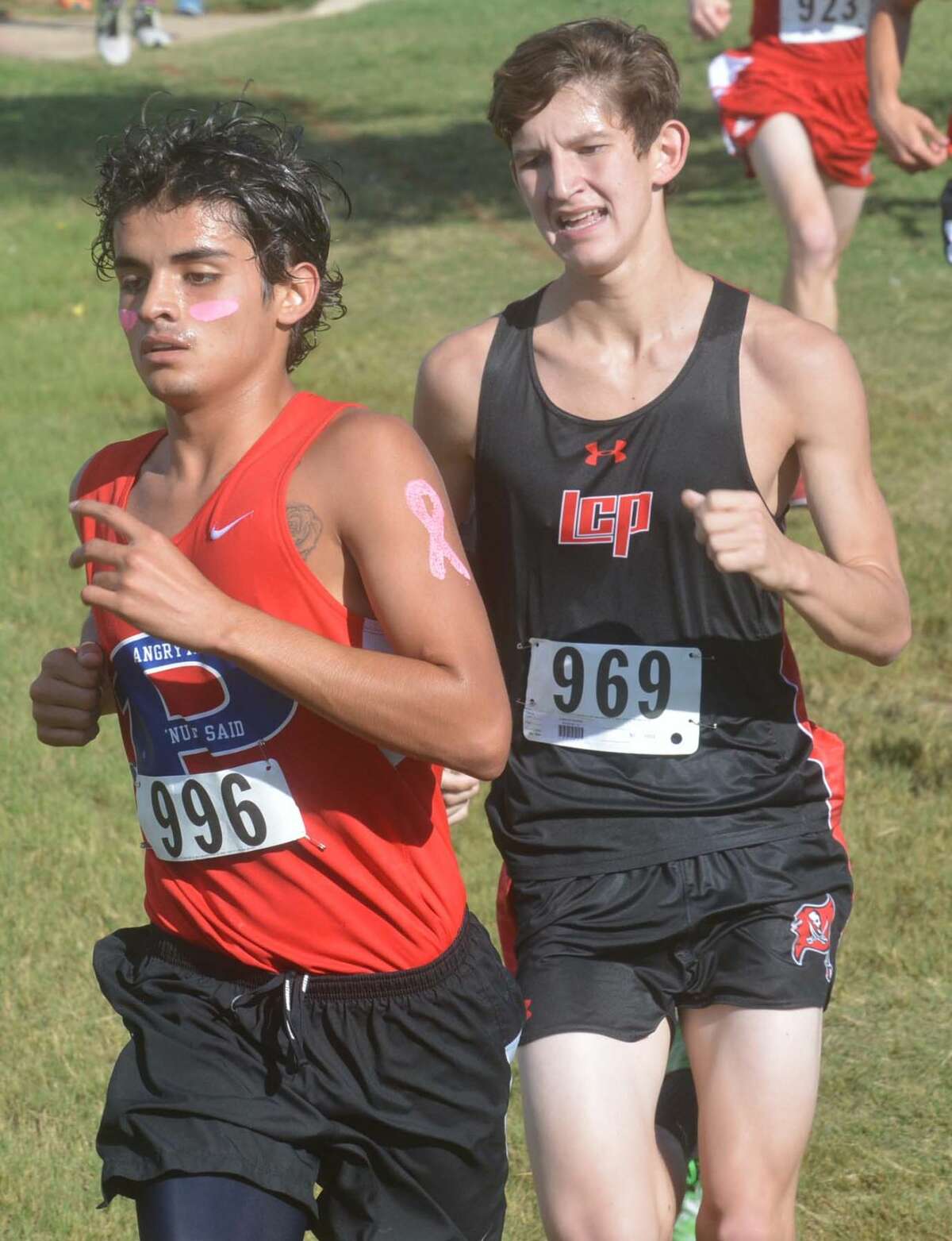 Plainview's Luis Castro (left) leads a Lubbock Cooper runner during the district cross-country meet last week. Castro, a senior, and the Bulldogs will compete at the regional meet at Mae Simmons Park in Lubbock Monday. The race is slated for 11:30 a.m.
