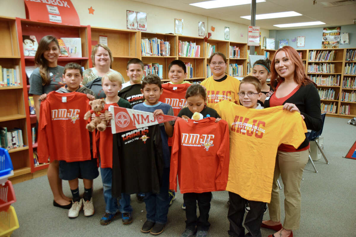 Highland gets college gearJan Seago/Plainview ISDNew Mexico Junior College representatives Diana Juarez (left) and Natalie De Jesus (right) made a stop at Highland Elementary on Tuesday to bring NMJC T-shirts, stuffed mascots and a banner to share with students. The representatives were invited to visit the campus by teacher Sharon Lambeth (back, second from left) as part of the campus’ effort to build college and career readiness. Lambeth is an alumni of NMJC. Students displaying the NMJC items are Joshua Barretero (front left), Andrew Myrick, Anthony Lucio, Justice Rodriguez, Smiley Estrada, Andrew Camacho (back left), Sebastian Mendoza, Cloe DeLeon and Zaima Davila.