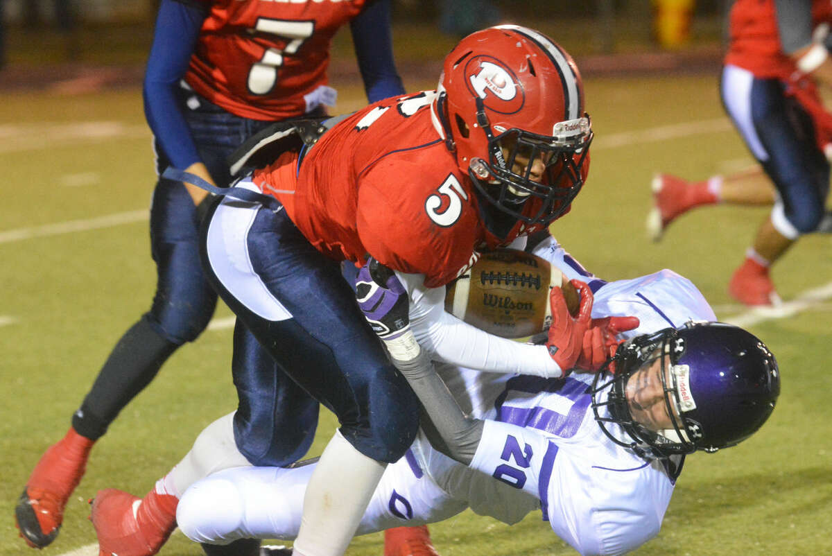 Plainview running back Warren Flye runs over a Canyon defender during a game earlier this season. The senior is off to a fast start this season with 497 yards rushing and 249 yards receiving in four games.