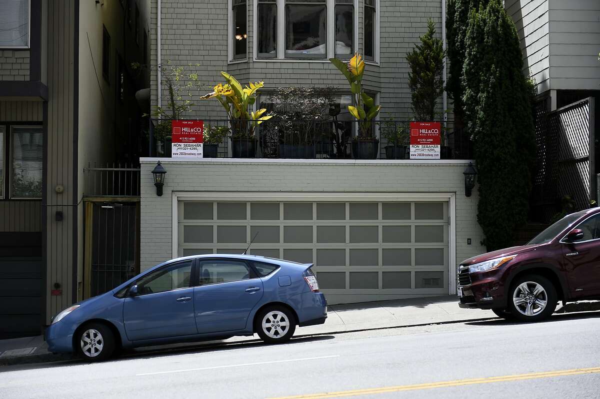 For sale signs outside a home for sale on Broadway St. on Tuesday, July 19, 2016 in San Francisco, California.