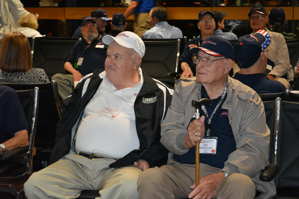 John McDonough (right), a World War II Army veteran, is another Plainview resident participating in the 2014 South Plains Honor Flight that departed from Lubbock on Wednesday morning. Accompanying him is son Mike McDonough (left), also from Plainview.