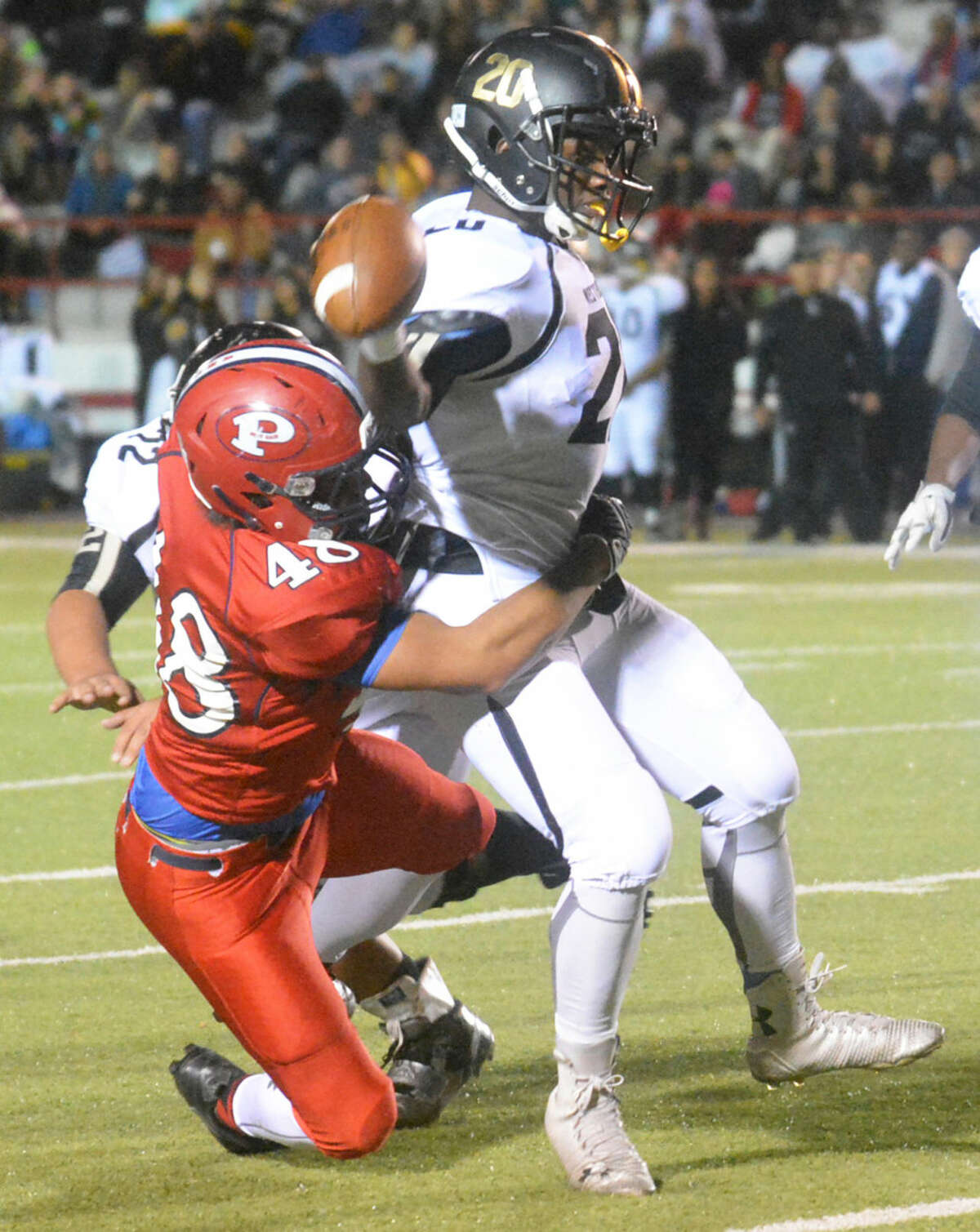 Plainview defensive end J'ryn Vela (48) sacks the Lubbock High quarterback during the final regular-season football game. Vela was part of a veteran defensive unit that played solidly throughout the year.