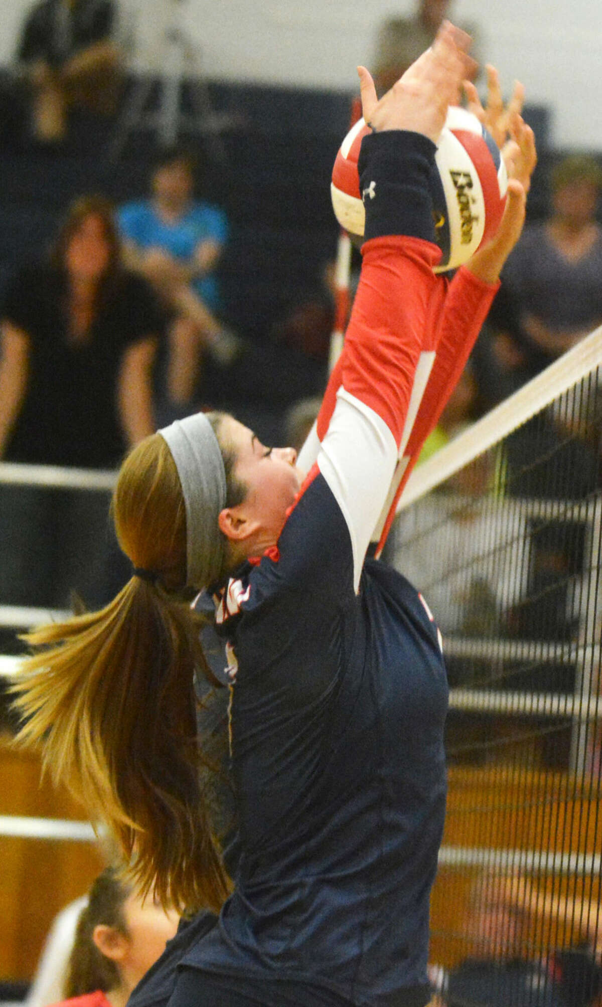 Plainview's Brooke Walker goes above the net to block a Lubbock High shot during a District 4-5A volleyball match at the Dog House Tuesday night. The left-handed senior had 34 kills in a tough five-game loss to the Lady Westerners.