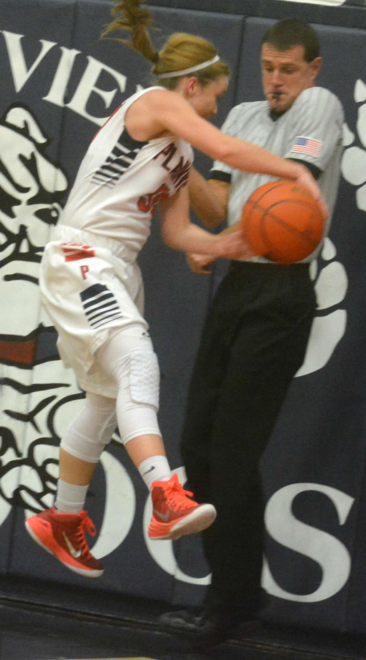 Plainview's Jaden Gonzales tries to save the ball from going out of bounds as an official tries to stay out of the way during a game against Hereford Tuesday night.