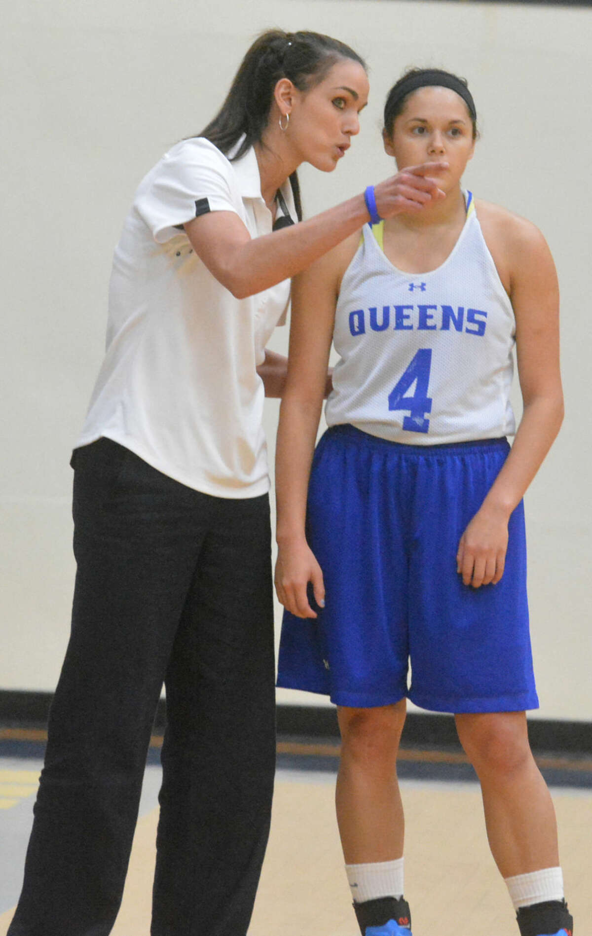 Wayland Baptist University women's basketball coach Alesha Robertson-Ellis points something out to Flying Queen Shawna Monreal (4) during a scrimmage earlier this season. Robertson-Ellis is beginning her second season as the Flying Queens' coach.