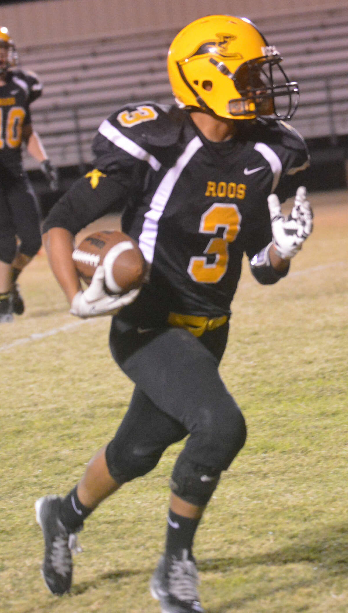 Kress quarterback Jordan Reyes races toward the end zone Friday night. The sophomore scored the winning touchdown with 19 second s left to lift the Kangaroos to a district championship.