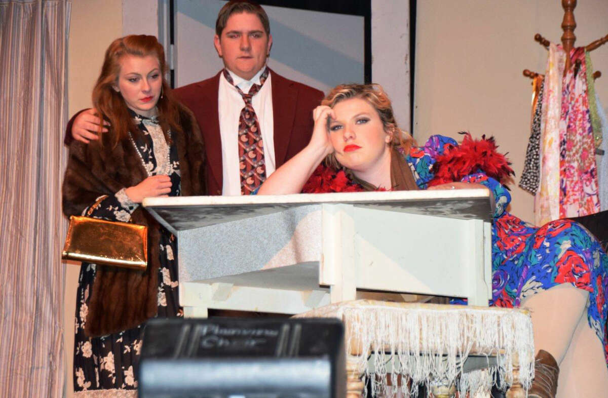 Miss Hannigan's brother Rooster and his girlfriend Lily plot to impersonate Annie's parents to receive the offered reward. Deidre Howard as Lily St. James (left), Landon Taylor as Rooster and Morgan Sweeney as Miss Hannigan.