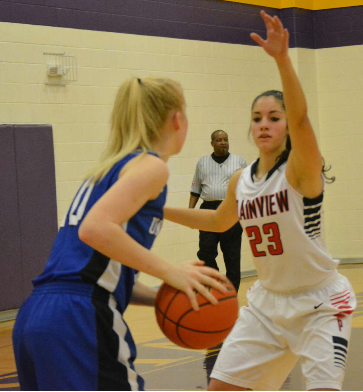 Plainview's Karli Wheeler defends against a New Braunfels player during the American Bank of Texas Tournament in Marble Falls. Plainview won two of three games, including a 66-36 victory over Marble Falls High Saturday, to take third place in the Silver Bracket. Wheeler was an All-Tournament selection.