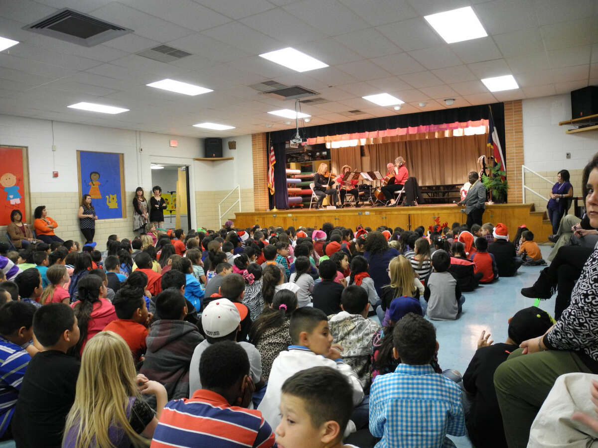 A string quartet from the Plainview Symphony Orchestra played holiday music for about 420 children, grades pre-K-5, in the school cafeteria at Hillcrest Elementary School Wednesday.