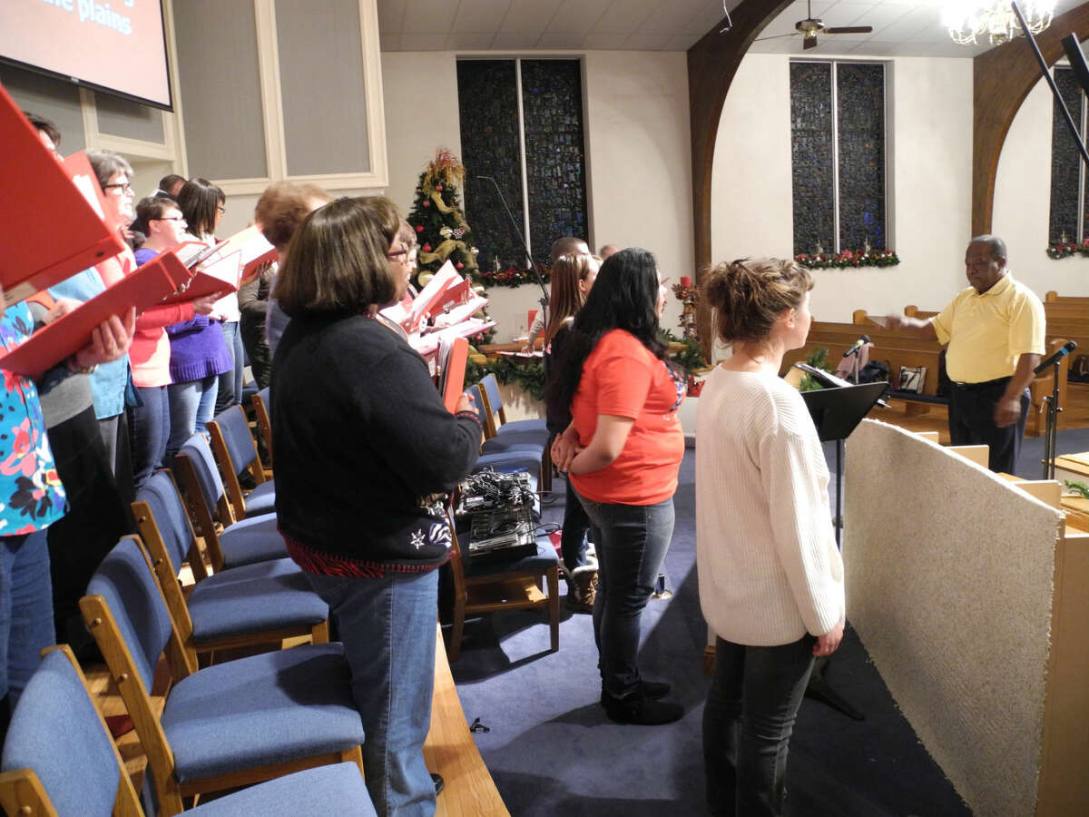Choir members directed by Joe Berry sing out at a rehearsal in preparation for the College Heights Baptist Church program “My Heart Longs for Christmas” to be presented at 6 p.m. Saturday, Dec. 13, and 10:40 a.m. Sunday, Dec. 14.