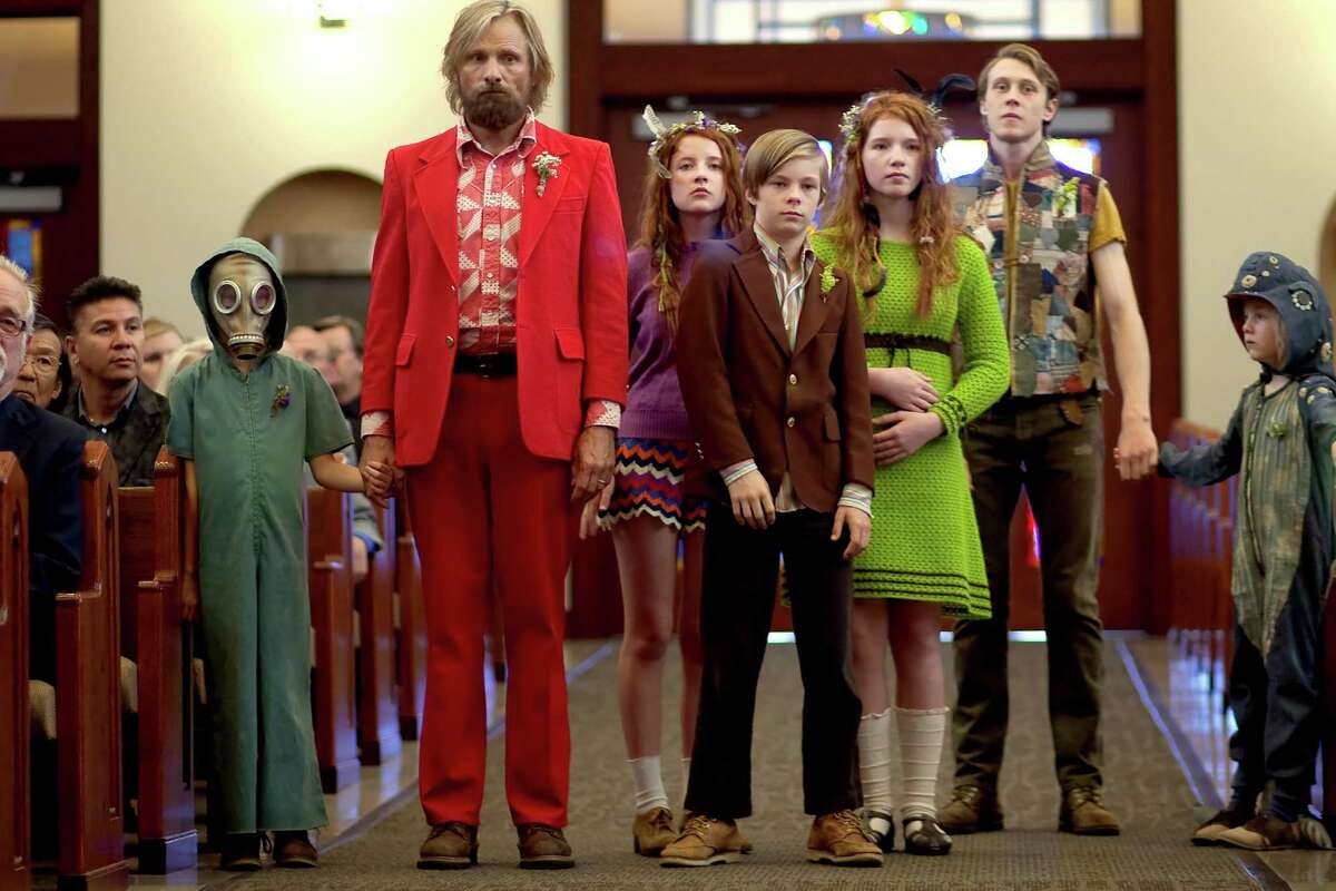 In this image released by Bleecker Street, Shree Crooks, standing from left, Viggo Mortensen, Samantha Isler, Nicholas Hamilton, Annalise Basso, George MacKay and Charlie Shotwell appear in a scene from, "Captain Fantastic." (Cathy Kanavy/Bleecker Street via AP)