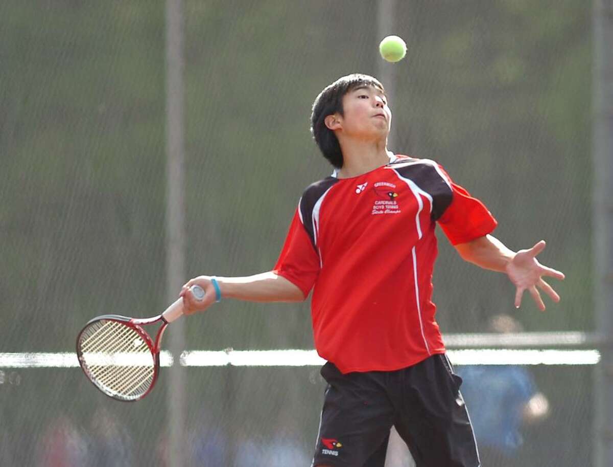 Tatsuya Tasaki of Greenwich High School, hits during his match against Camden Marco of Staples High School, Tuesday afternoon, April 27, 2010.