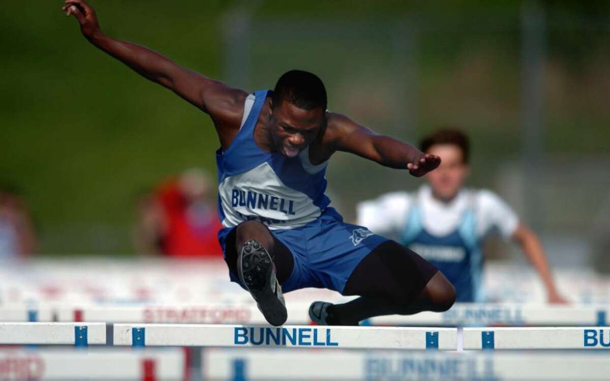 Bunnell's David Camille takes first place in the 100 meter hurdles during the boys track meet Tuesday Apr. 27, 2010 against Oxford, Joel Barlow and New Milford.
