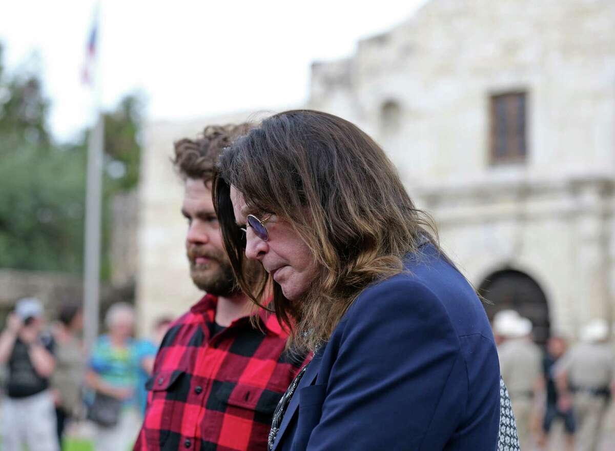 Ozzy Osbourne (center) and his son Jack Osbourne prepare to tour the Alamo in November for their History Channel travel series.