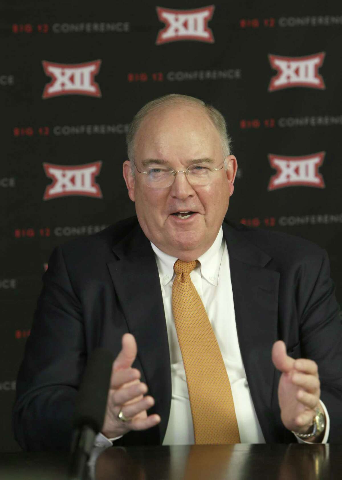 Texas athletic director Mike Perrin speaks to reporters after the Big 12 Conference meetings on Feb. 4, 2016, in Irving.