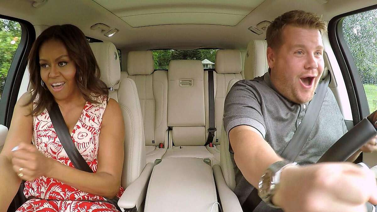 In this undated image released by CBS, first lady Michelle Obama, left, and James Corden, host of "The Late Late Show with James Corden," appear during the taping of a Carpool Karaoke segment which will air on the late night talk show on Wednesday, July 20, 2016. (CBS via AP)