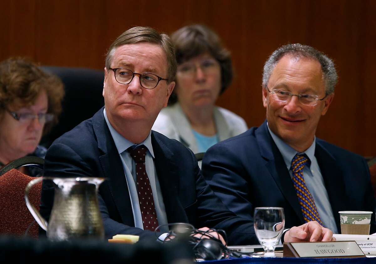 UCSF chancellor Sam Hawgood (left) and UC Davis acting chancellor Ralph Hexter attend a meeting of the University of California Board of Regents to consider an amendment of a policy on outside professional activities of top university management officials in San Francisco, Calif. on Thursday, July 21, 2016.