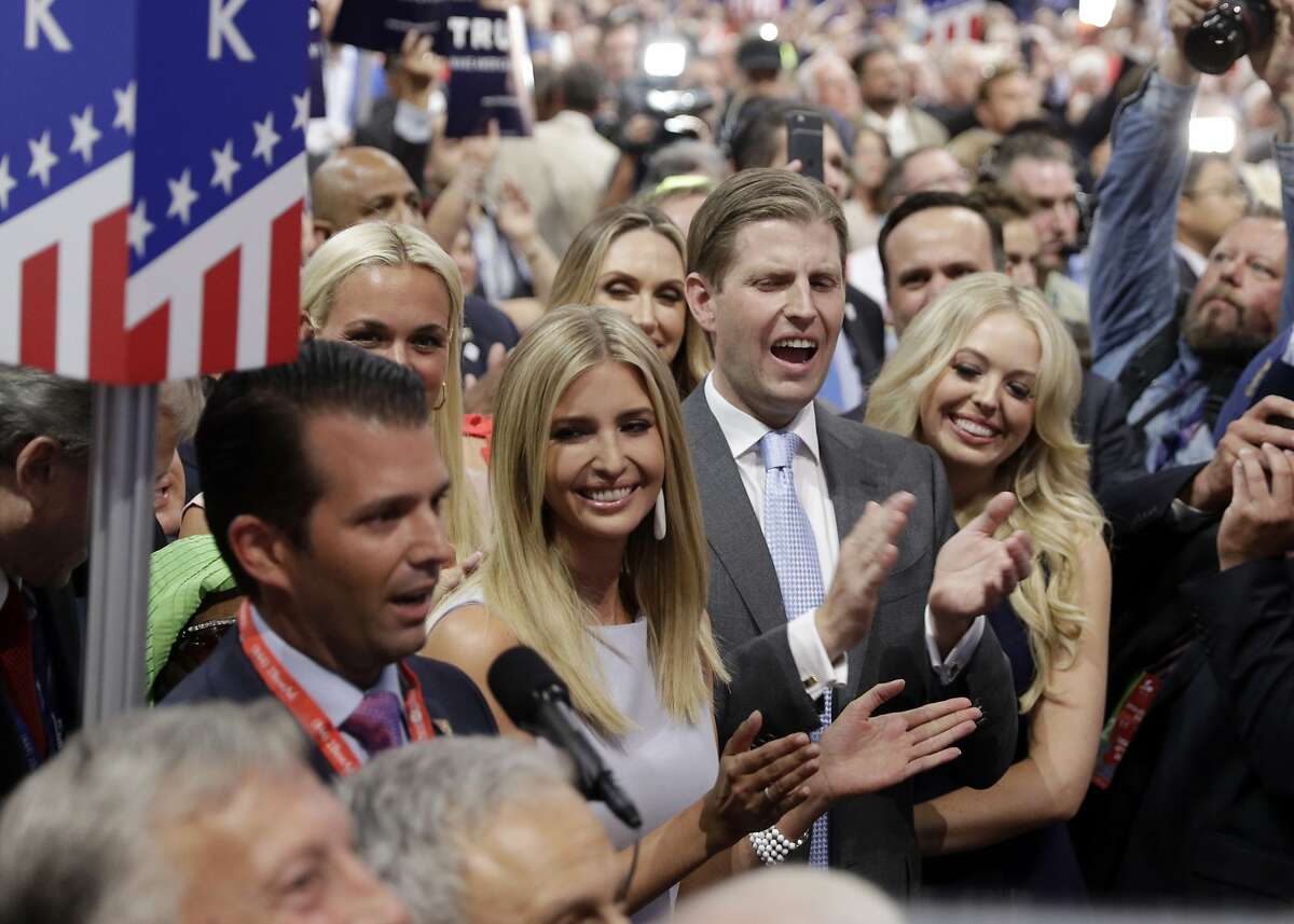 Republican Presidential Candidate Donald Trump's children Donald Trump, Jr., Ivanka Trump, Eric Trump and Tiffany Trump celebrate on the convention floor during the second day session of the Republican National Convention in Cleveland, Tuesday, July 19, 2016. (AP Photo/Carolyn Kaster)